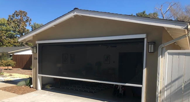 Completed Apollo motorized garage screen installation on double garage door