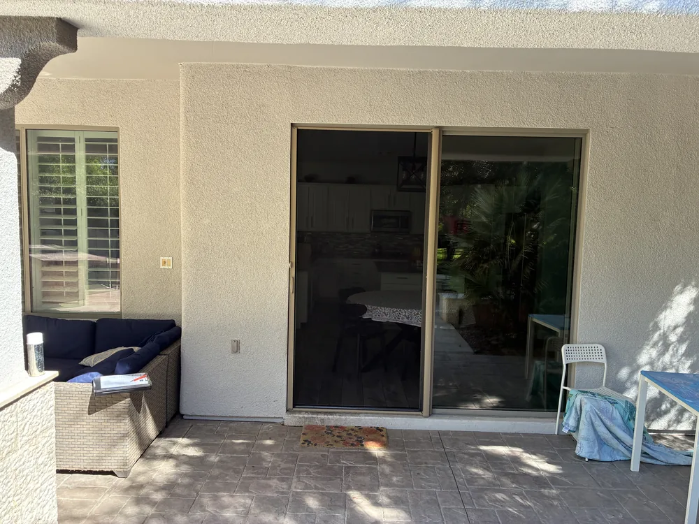 Apollo retractable sliding screen door extended across a patio slider, Anthem Country Club, NV